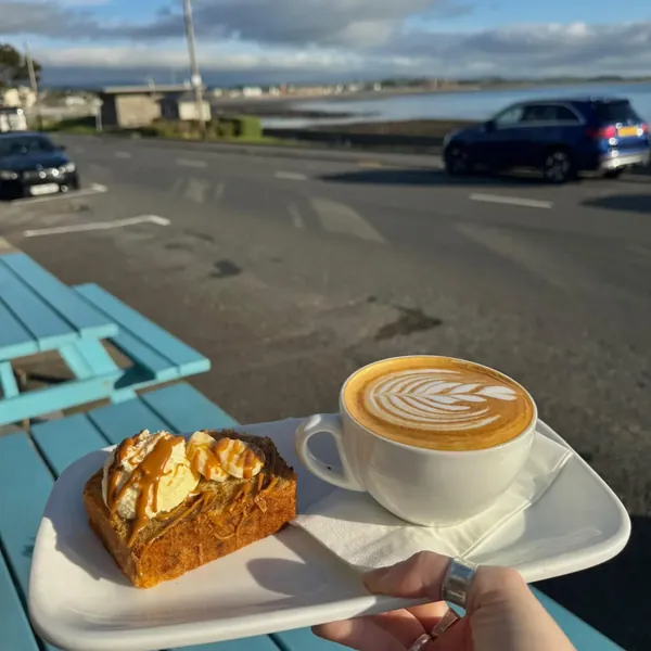 Biscoff banana bread and a cappuccino on the promenade
