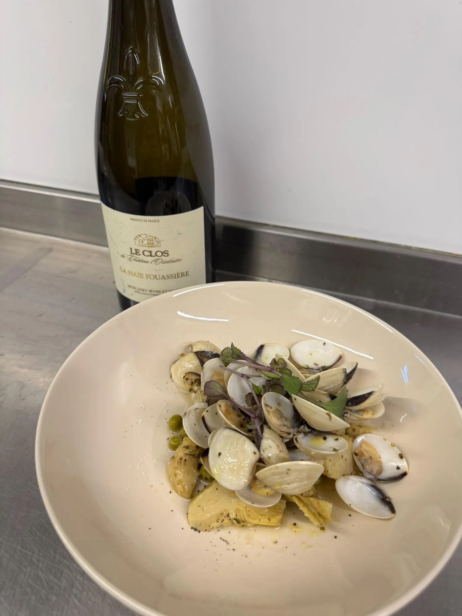 Clams with a bottle of white wine from a wine dinner evening