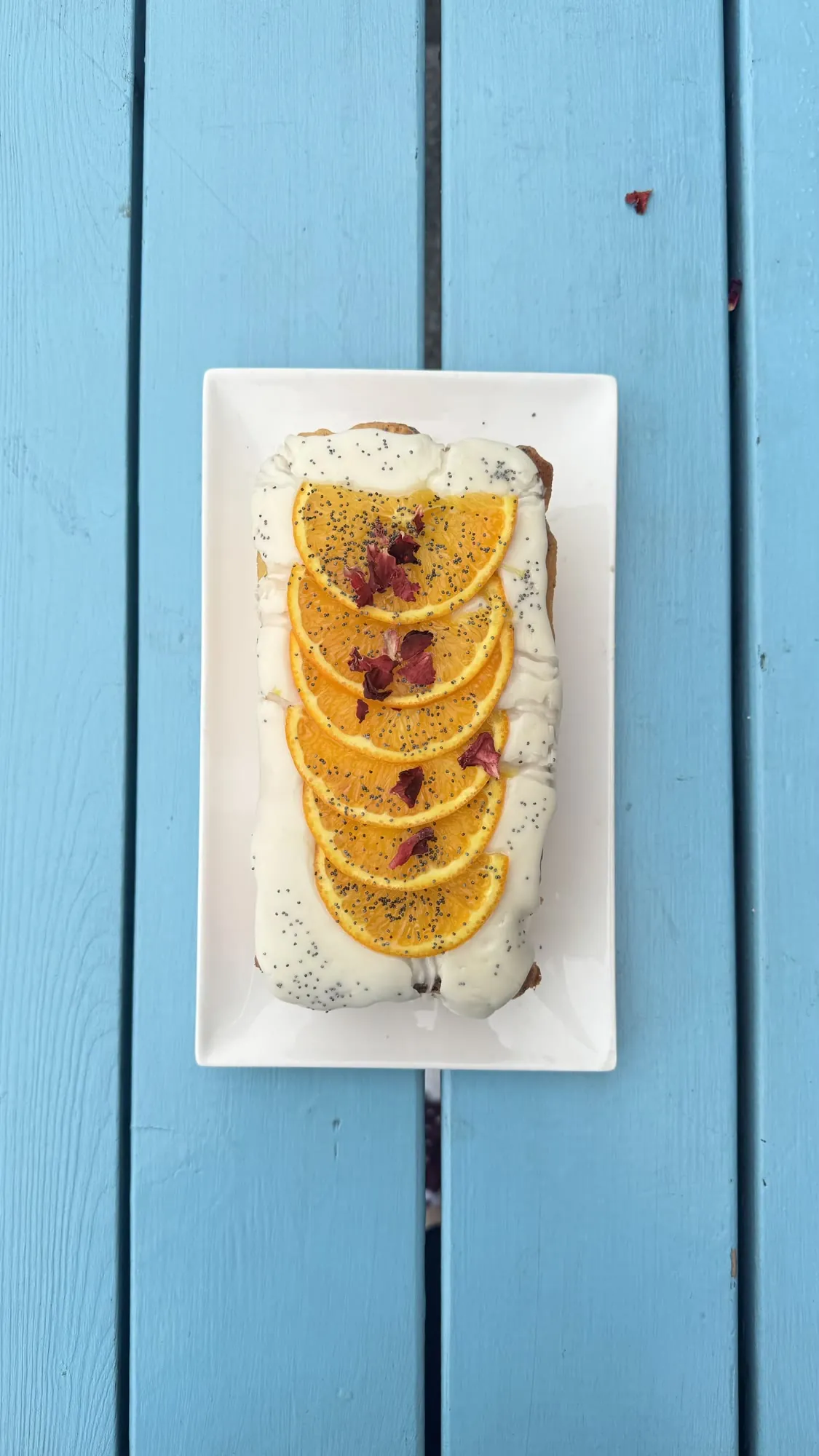Orange loaf cake topped with fresh orange slices