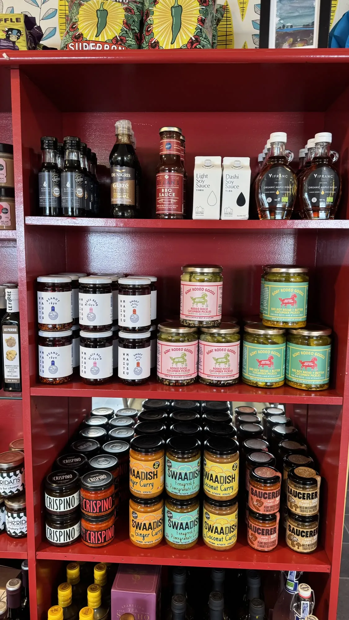 Red shelves of jams, chutneys and sauces in the Olive Bizarre shop