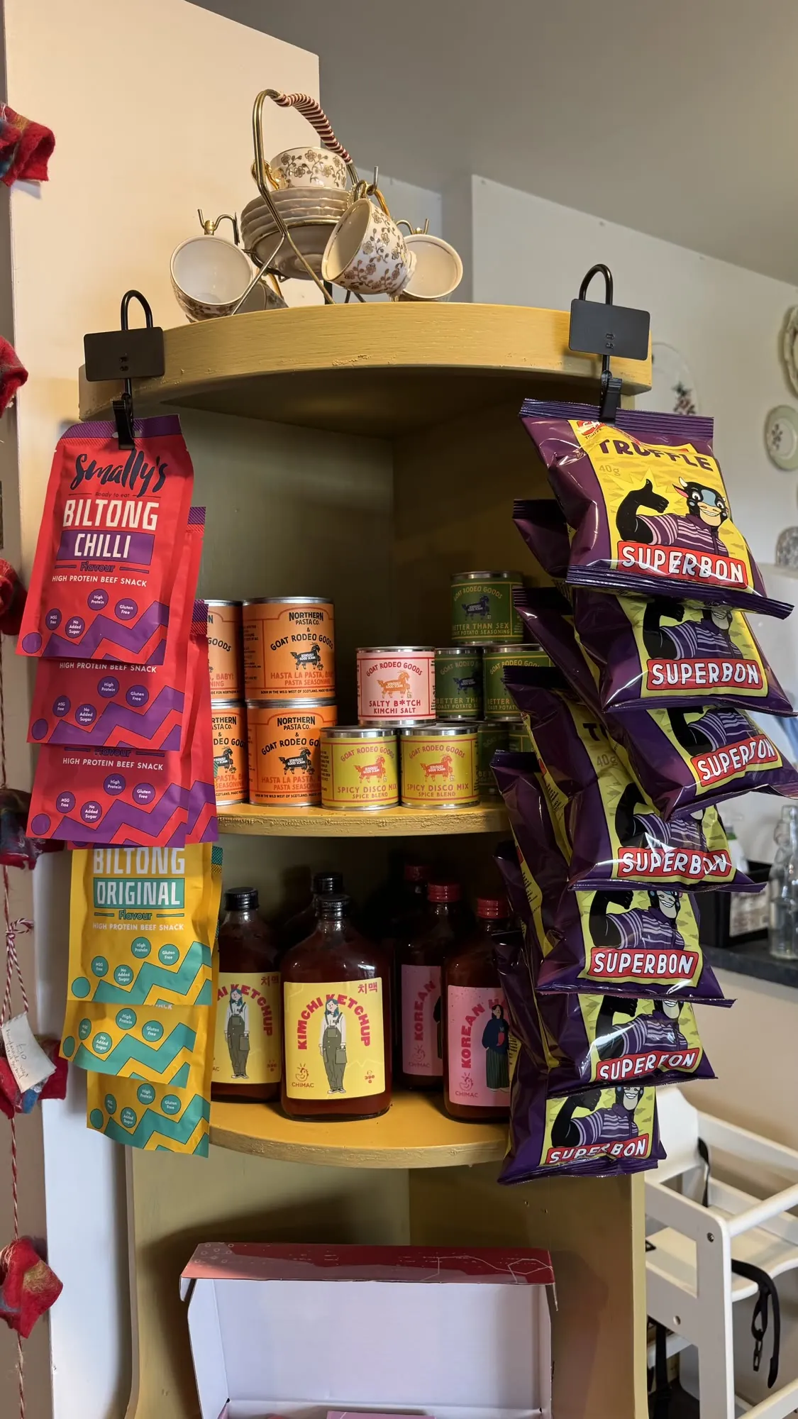 A corner of the shop with chilli sauces and snacks