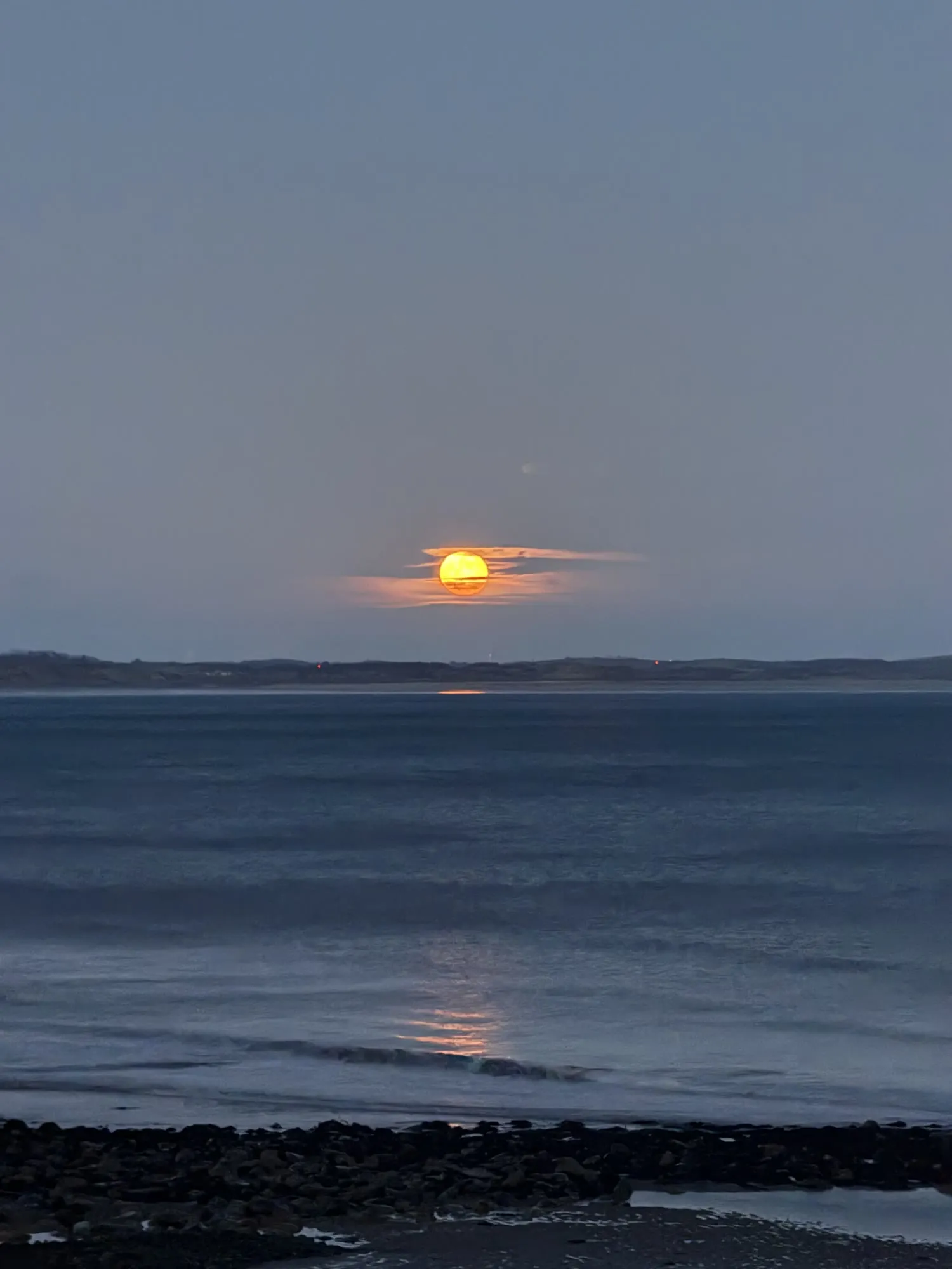 Sunset over the sea from the promenade in Newcastle